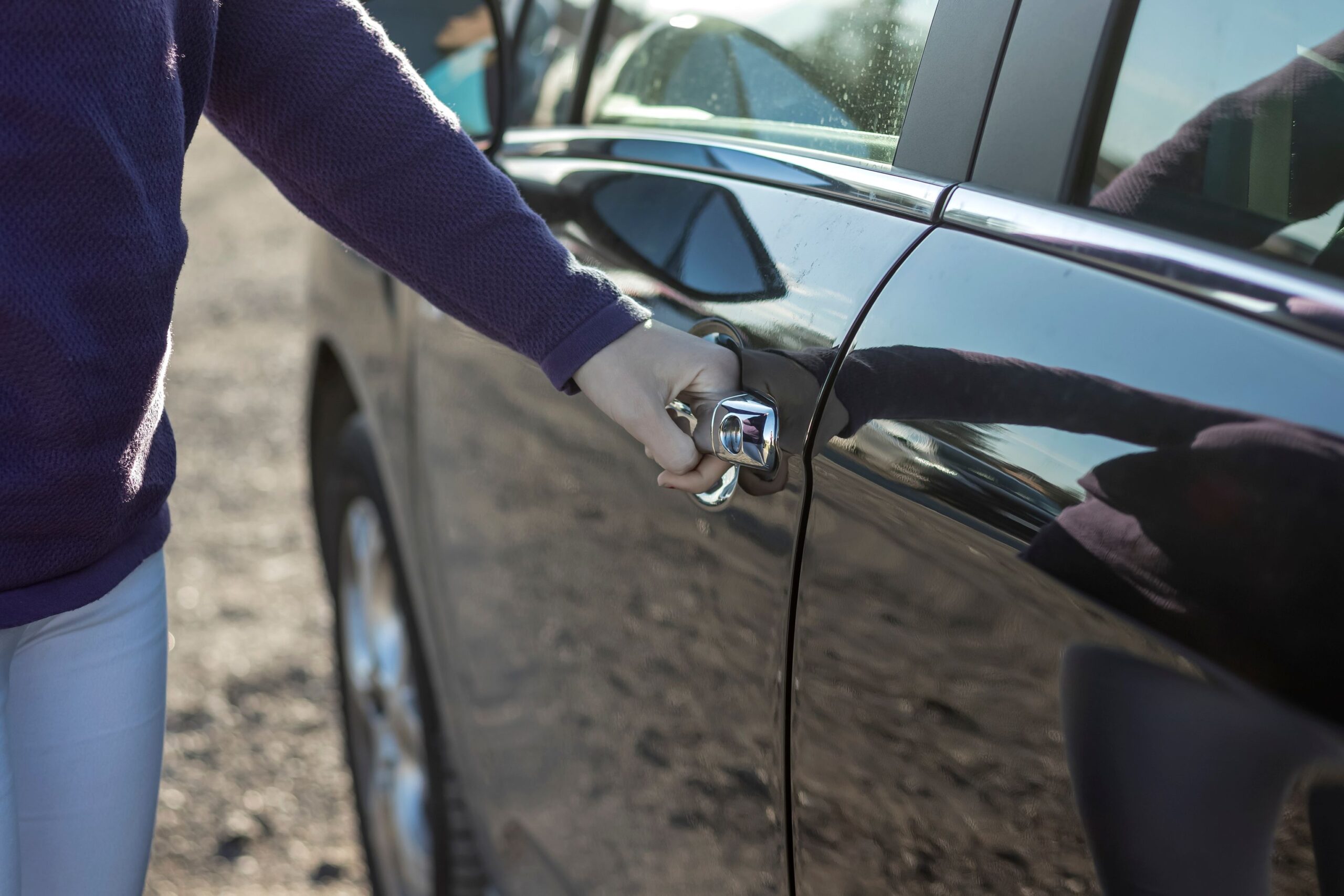 car unlocks, woman use key to open the car door